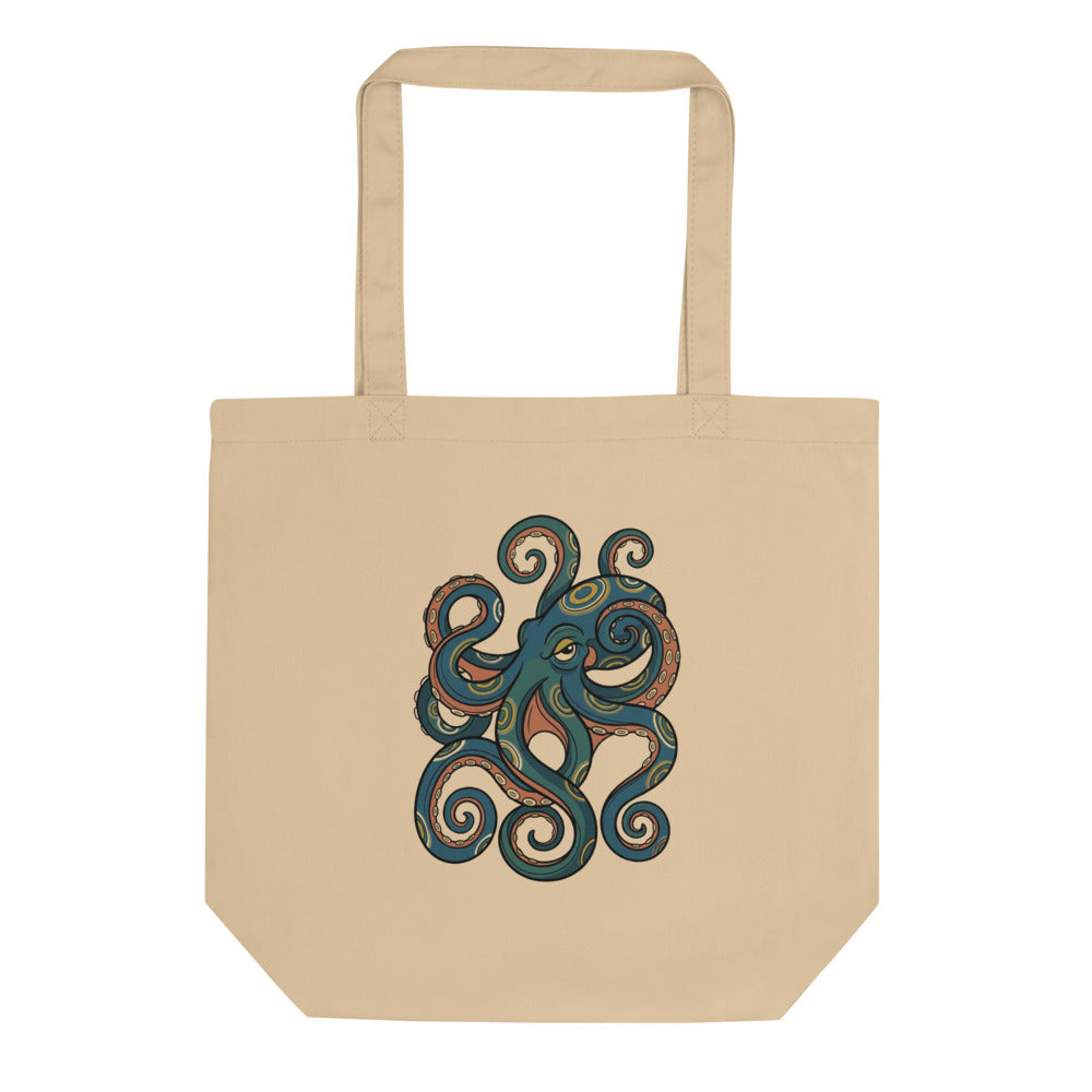 Tote bag céphalopode design – illustration line-art d'un poulpe à anneaux bleus irisés moutarde et crème sur fond bleu pétrole, impression DTG haute définition, 38×42 cm