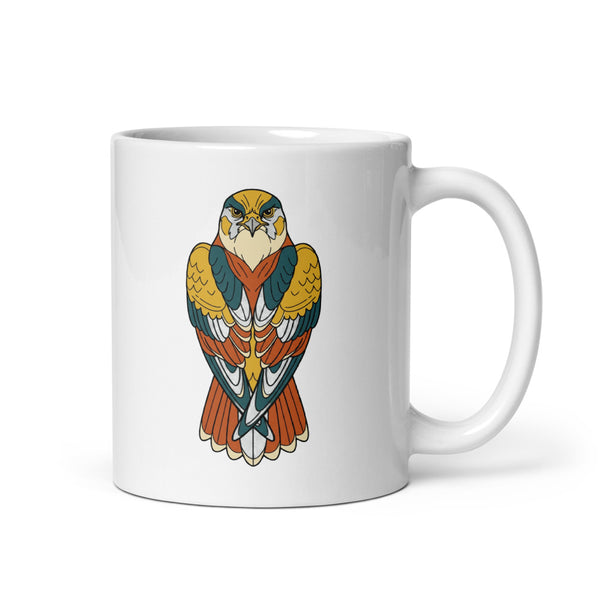 Mug faucon pèlerin en céramique blanche 325 ml, vue de face – illustration line-art aux tons moutarde, terracotta et bleu pétrole, regard perçant du rapace au centre