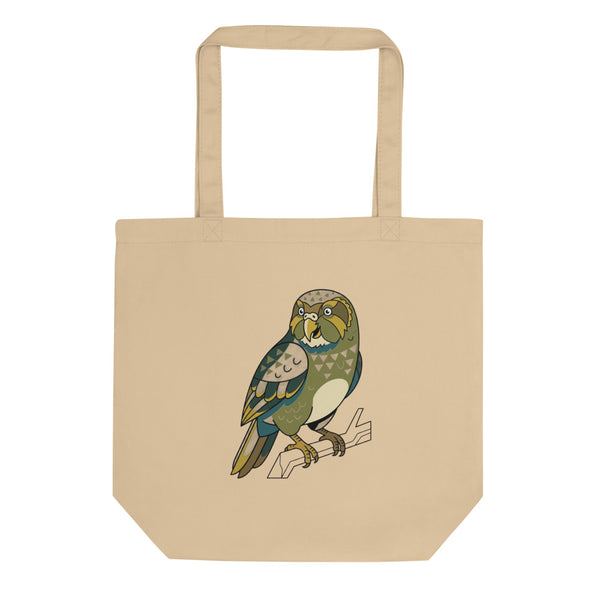 Tote bag kakapo illustration line-art de face, aplats vert forêt et accents moutarde sur toile de coton blanc, contours encre noire géométriques
